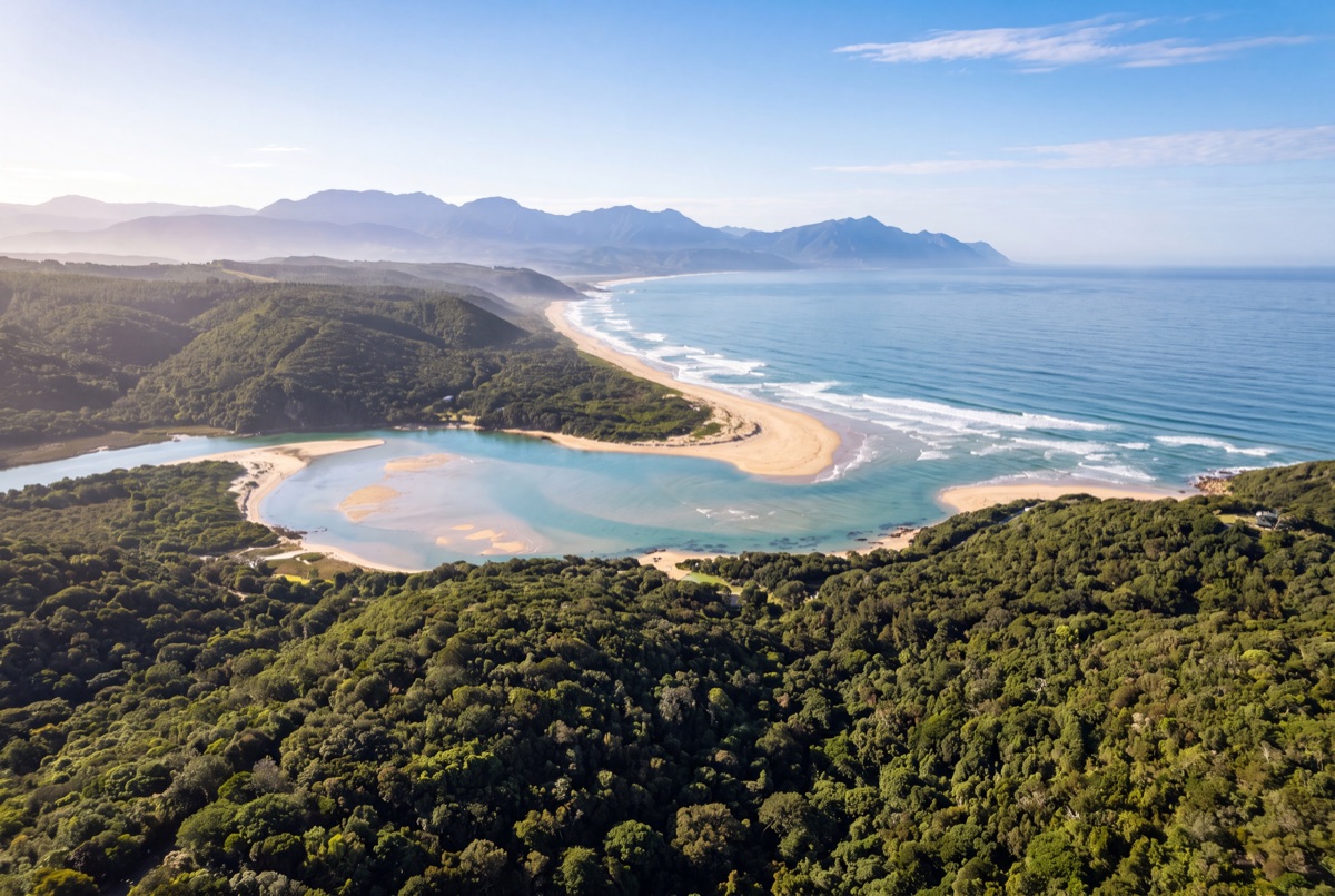 The forested coastline and lagoon of the Garden Route from the air
