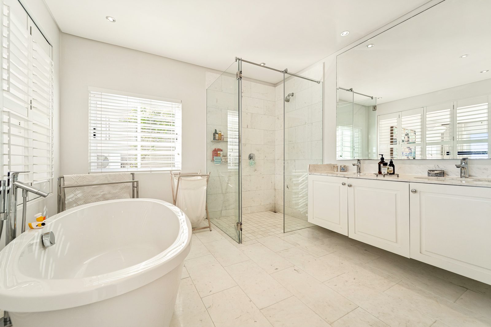 Principal bedroom, shutters open to the pool and the sea