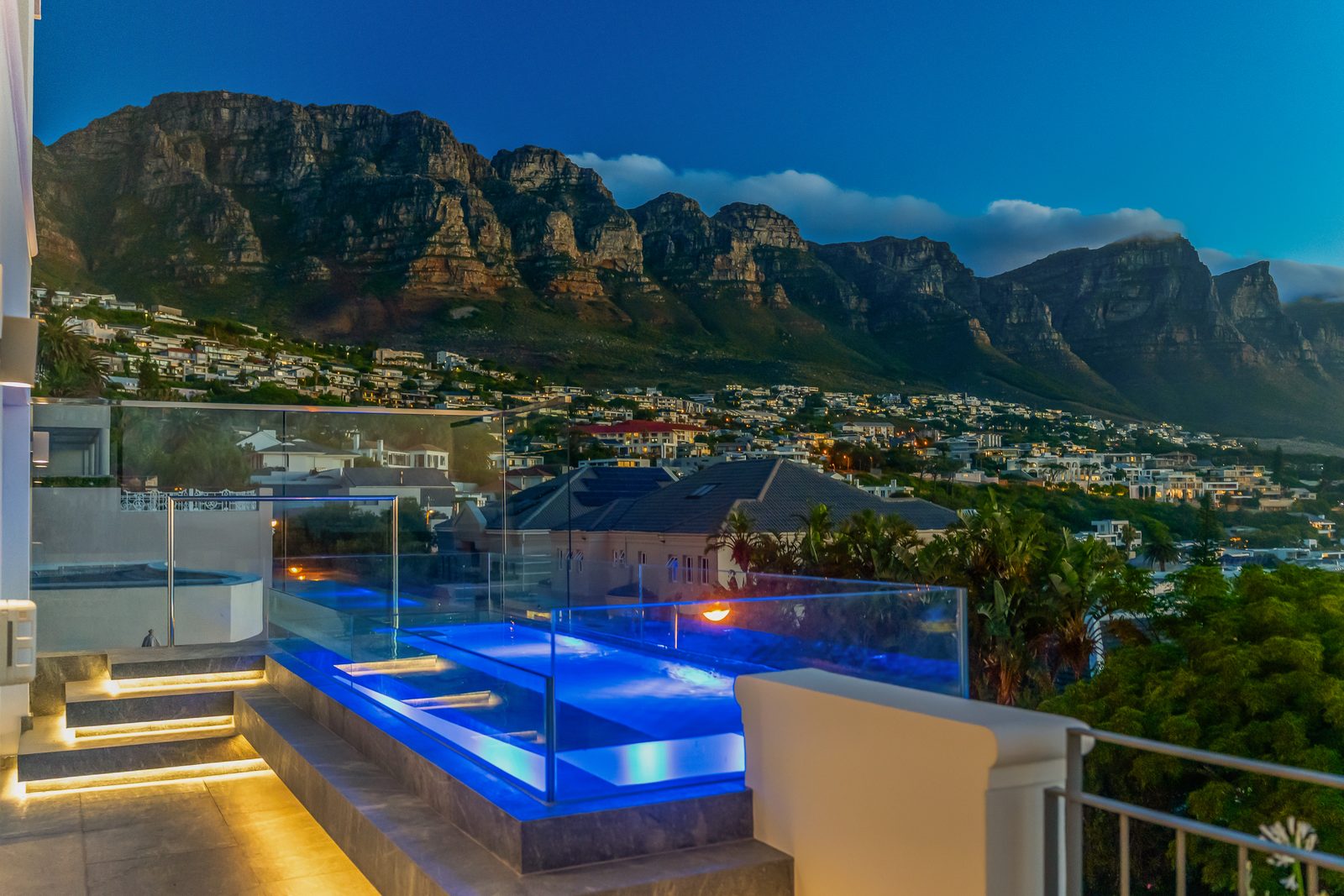 The villa lit at night on the Camps Bay slopes