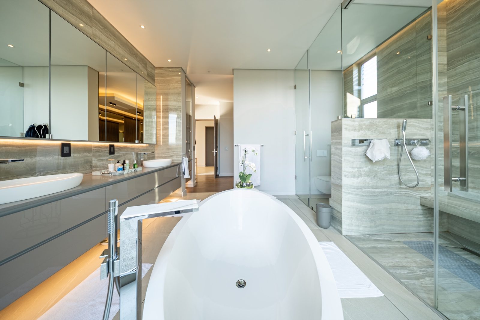 Principal bathroom with freestanding bath and double shower