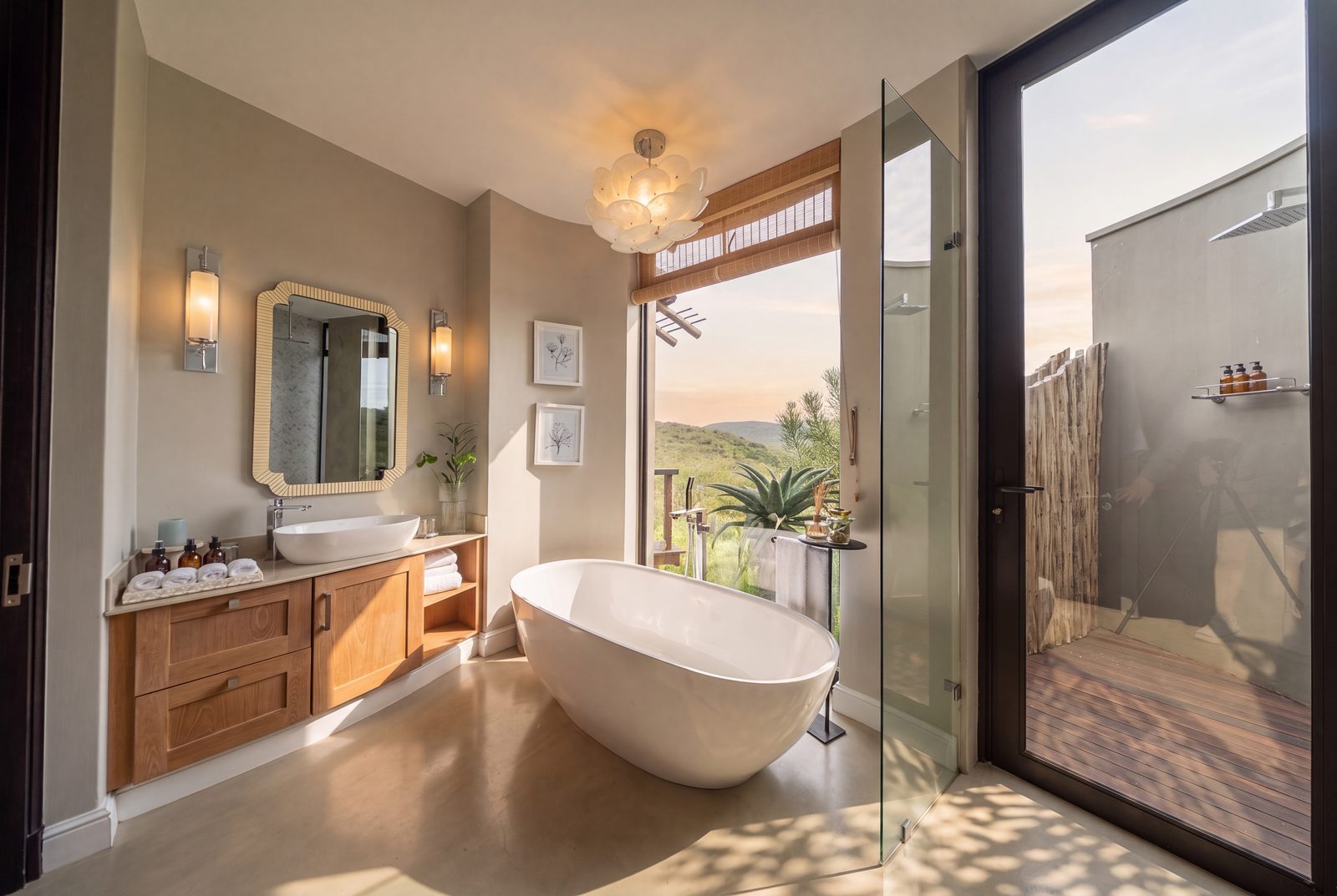 Four-poster suite against the bushveld window