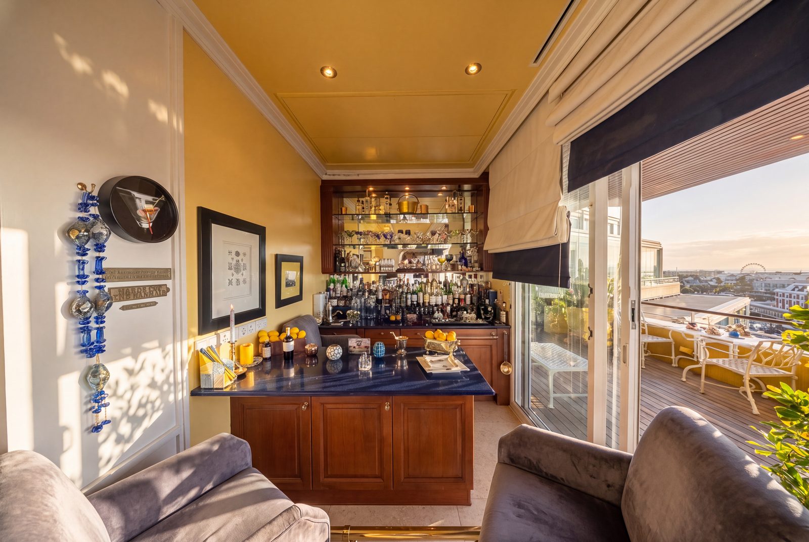 The cocktail bar, mirrored shelving and the terrace beyond