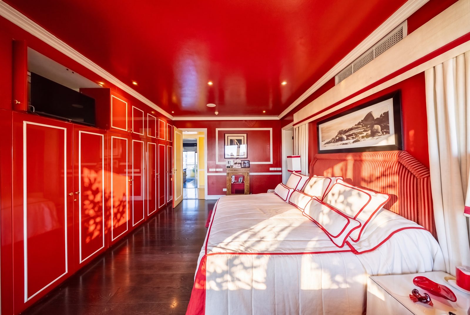 The primary suite's lacquered wardrobe wall