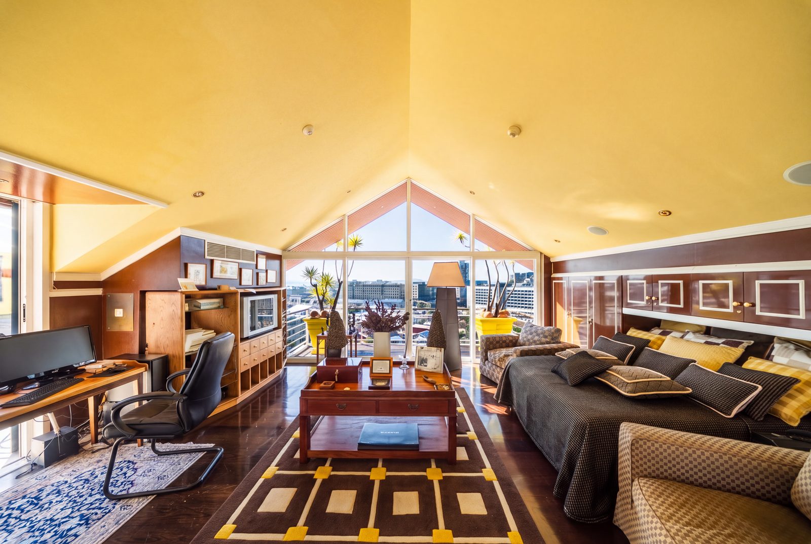 The upper level third bedroom under its gabled ceiling